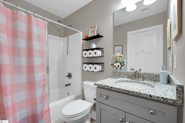 full bathroom with vanity, toilet, and shower / tub combo with curtain