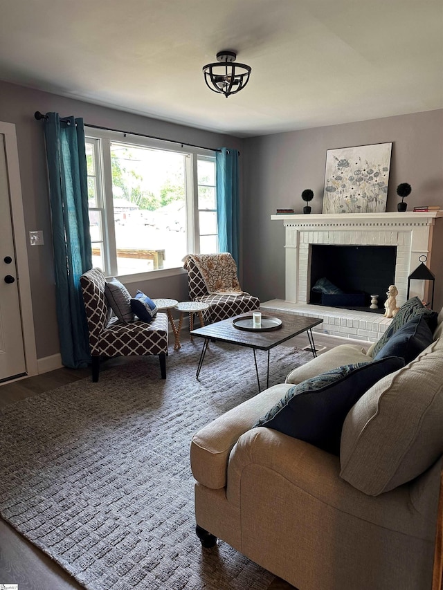 living room with hardwood / wood-style flooring and a fireplace