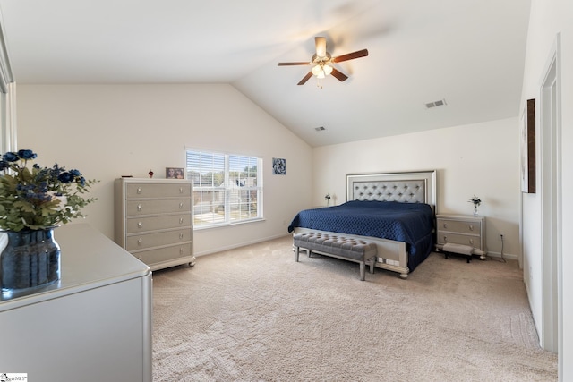 carpeted bedroom featuring ceiling fan and vaulted ceiling