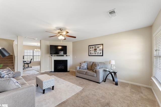 living room with ceiling fan and light carpet