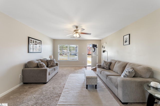 living room featuring light carpet and ceiling fan