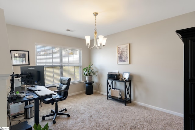 carpeted office space with an inviting chandelier