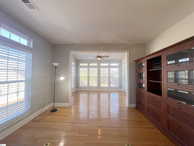 interior space with ceiling fan and light hardwood / wood-style floors