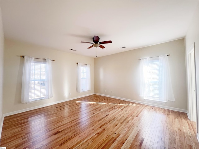 unfurnished room with ceiling fan and light hardwood / wood-style floors