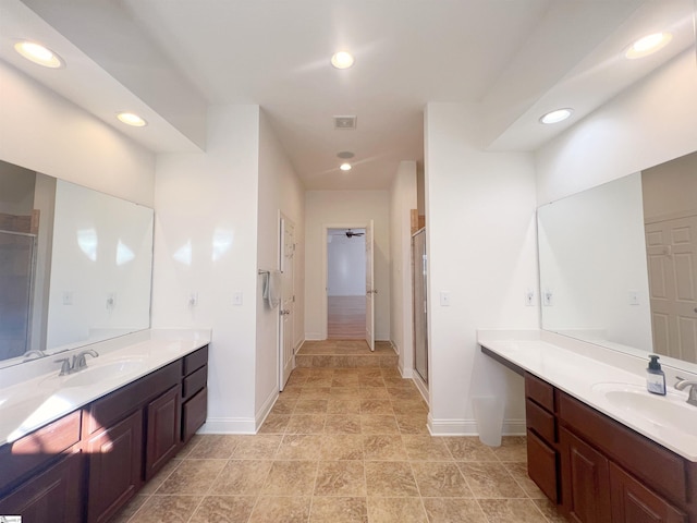 bathroom featuring vanity and an enclosed shower