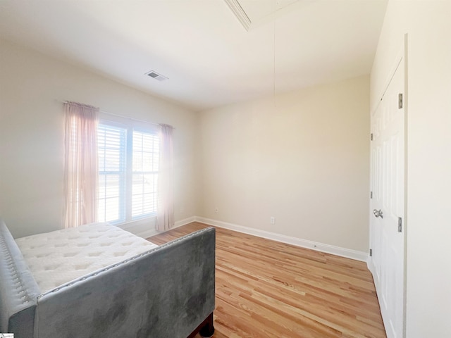 bedroom featuring hardwood / wood-style flooring