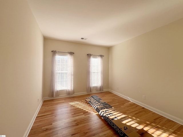 spare room featuring hardwood / wood-style flooring