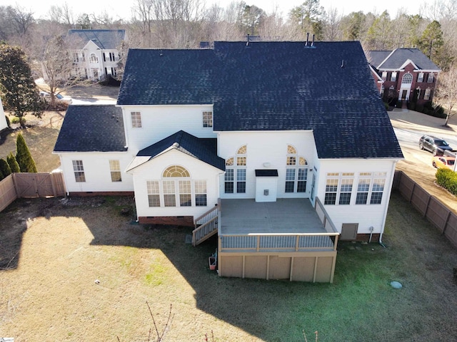 rear view of property featuring a yard