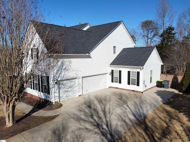 view of side of home featuring a garage