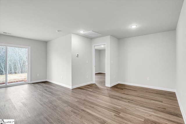 unfurnished room featuring hardwood / wood-style flooring