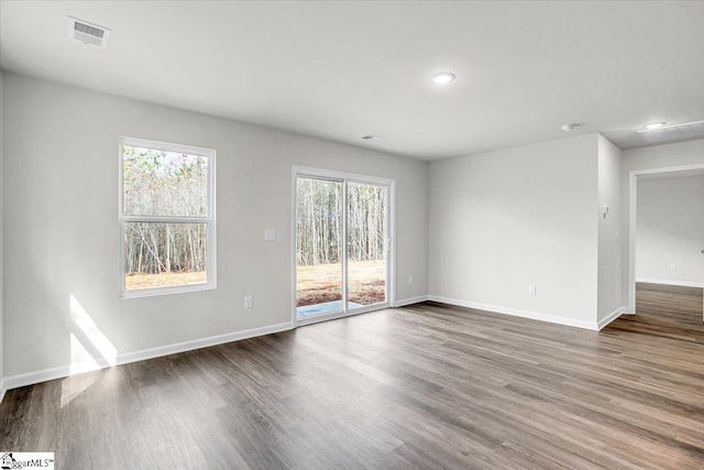 empty room with wood-type flooring