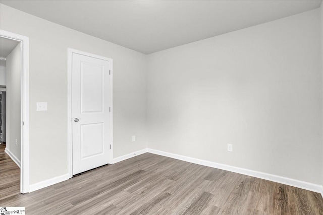 spare room with light wood-type flooring