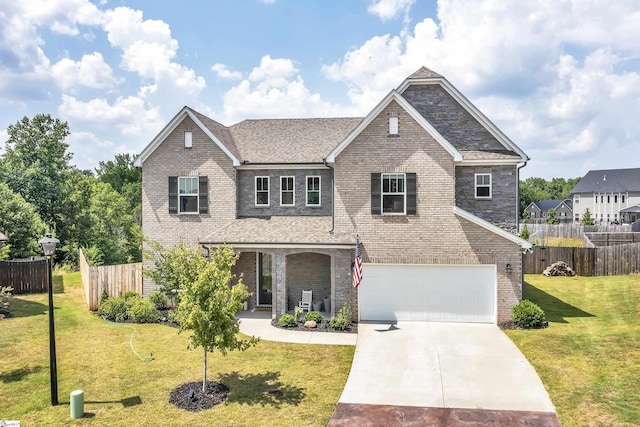 view of front of house featuring a garage and a front lawn