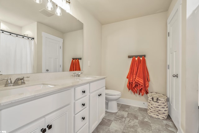 bathroom with vanity and toilet