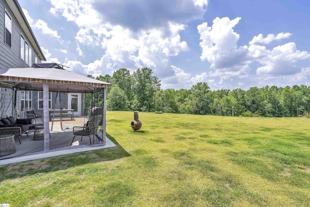 view of yard featuring a gazebo and a patio area