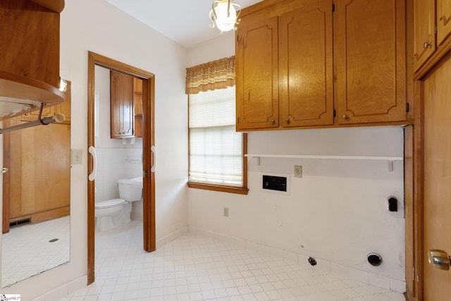 washroom featuring tile walls