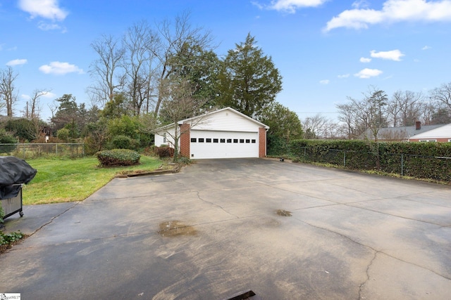 view of home's exterior with an outbuilding, a yard, and a garage