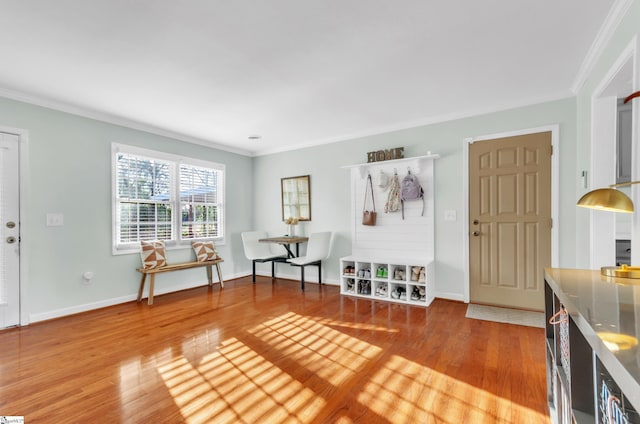 unfurnished room featuring wood-type flooring and crown molding