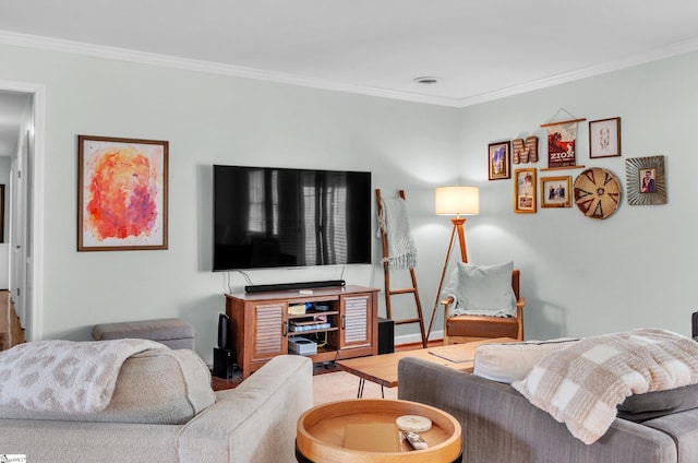 living room with hardwood / wood-style floors and crown molding