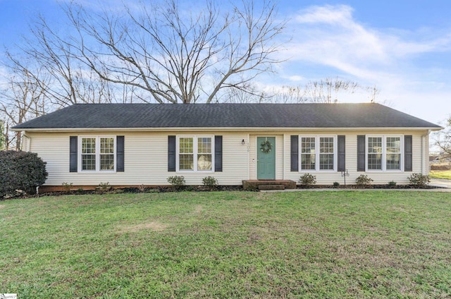 ranch-style home with a front yard