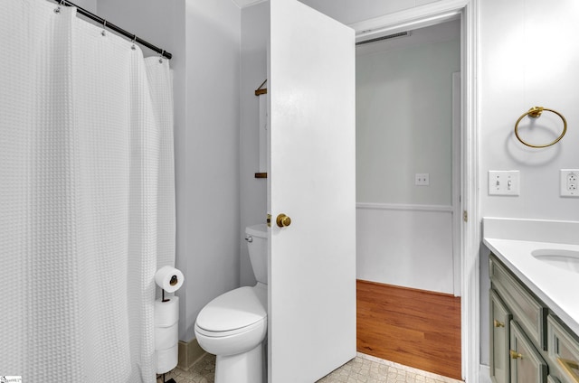 bathroom with vanity and toilet