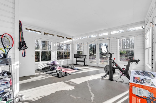 workout area featuring wood walls