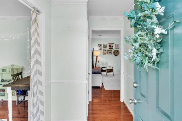 foyer with dark hardwood / wood-style floors and ornamental molding