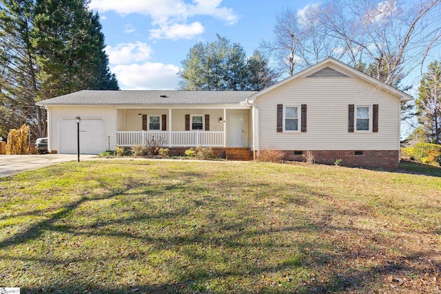 ranch-style home featuring covered porch, a garage, and a front lawn