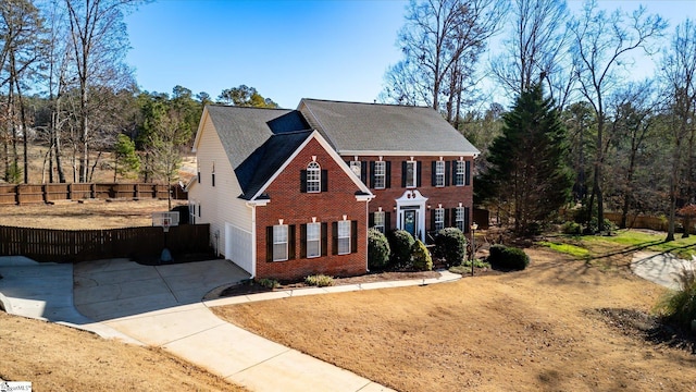 colonial home with a garage