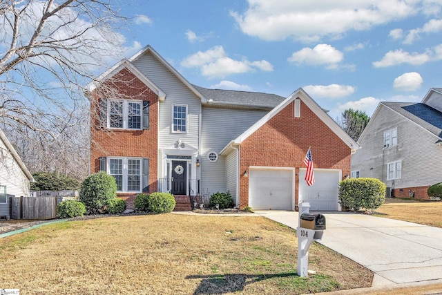 view of property with a garage and a front lawn