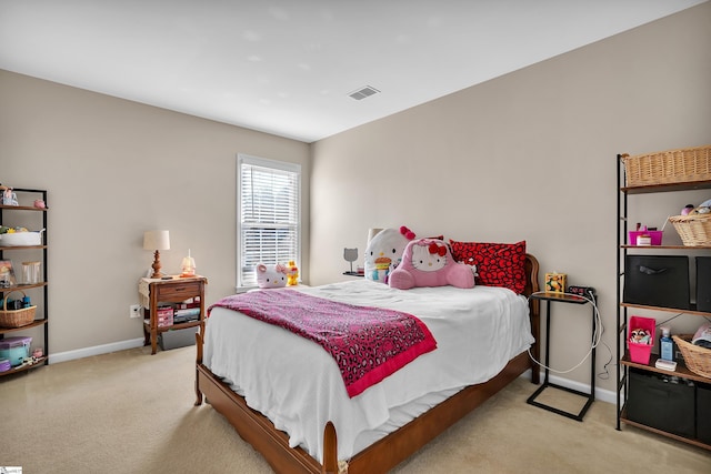 bedroom featuring light colored carpet