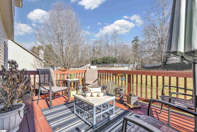 wooden deck with a yard