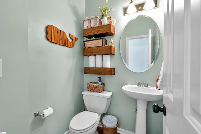 bathroom with toilet and sink