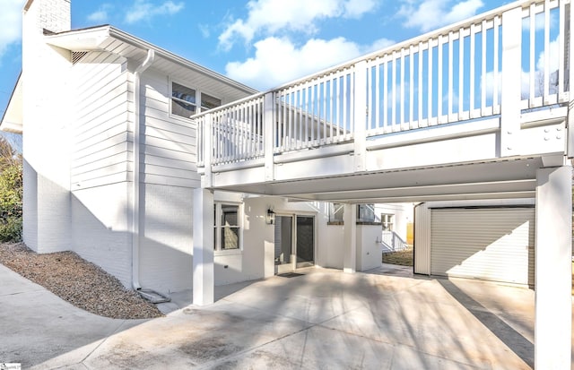 view of side of property with a balcony