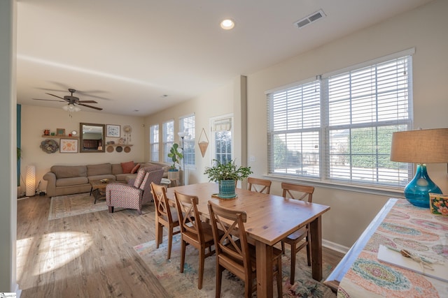 dining area featuring light hardwood / wood-style floors, plenty of natural light, and ceiling fan