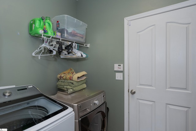 clothes washing area featuring washing machine and dryer