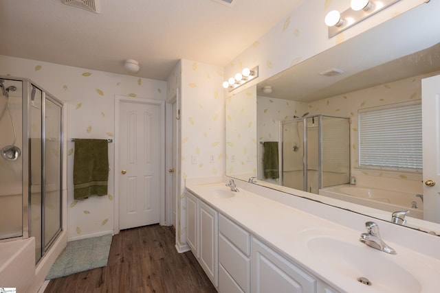 bathroom featuring vanity, hardwood / wood-style flooring, and independent shower and bath