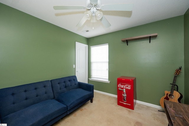 living room featuring ceiling fan and light colored carpet