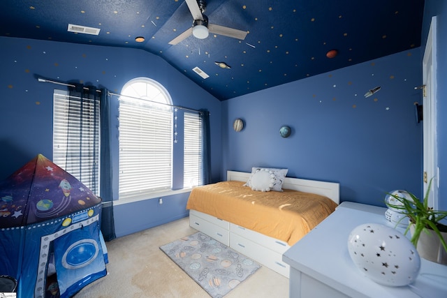 carpeted bedroom featuring multiple windows, ceiling fan, and vaulted ceiling