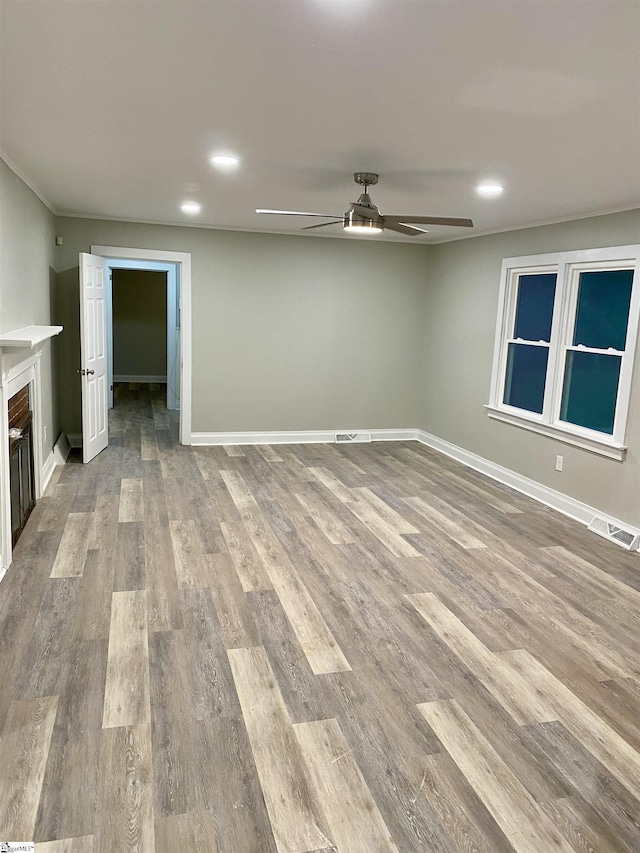 unfurnished room with ceiling fan and light wood-type flooring