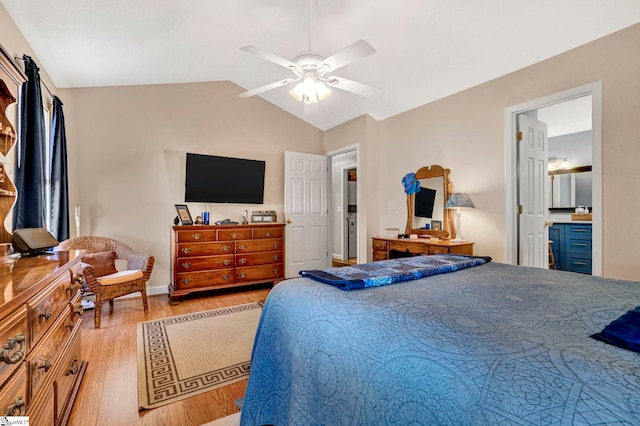 bedroom with connected bathroom, light hardwood / wood-style flooring, ceiling fan, and lofted ceiling