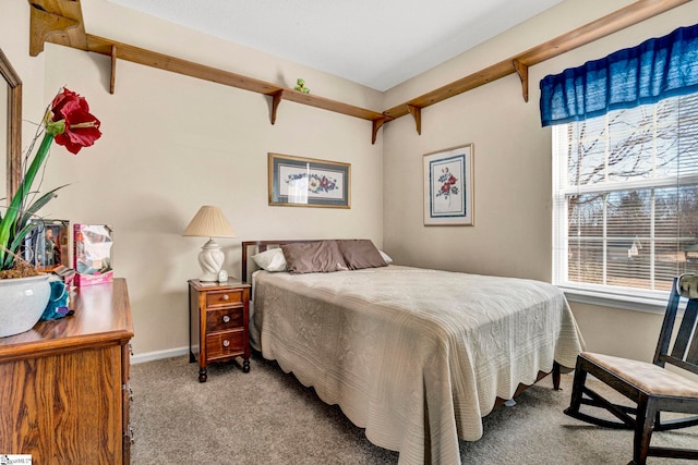 carpeted bedroom featuring multiple windows