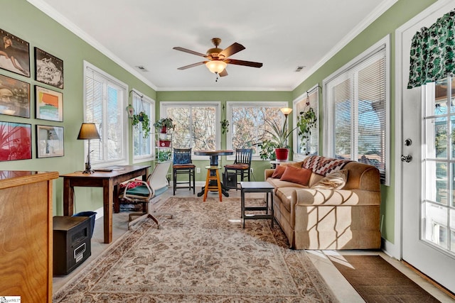 sunroom featuring ceiling fan