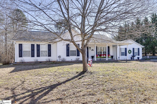 single story home featuring a front lawn and a porch