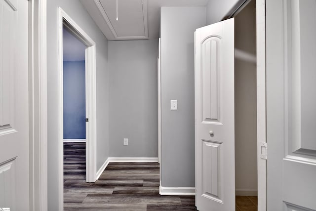 corridor with dark hardwood / wood-style floors