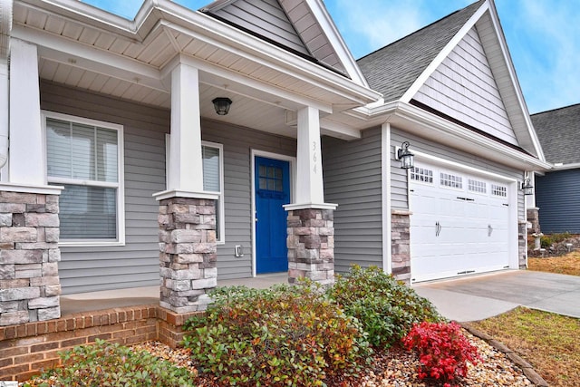 view of front of property featuring covered porch and a garage