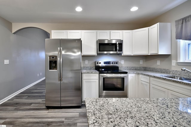 kitchen with white cabinets, sink, and stainless steel appliances