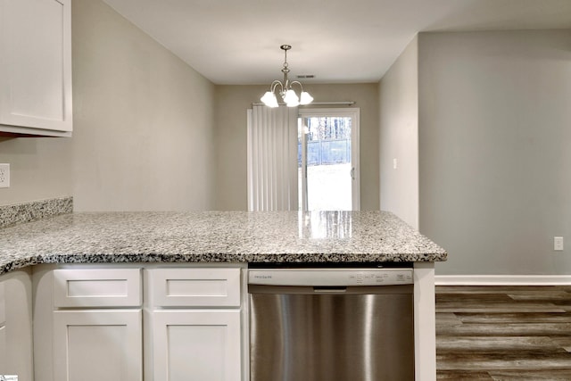 kitchen featuring white cabinetry, an inviting chandelier, light stone counters, stainless steel dishwasher, and decorative light fixtures