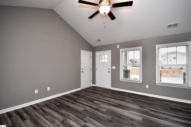 entrance foyer with ceiling fan, dark hardwood / wood-style flooring, and vaulted ceiling