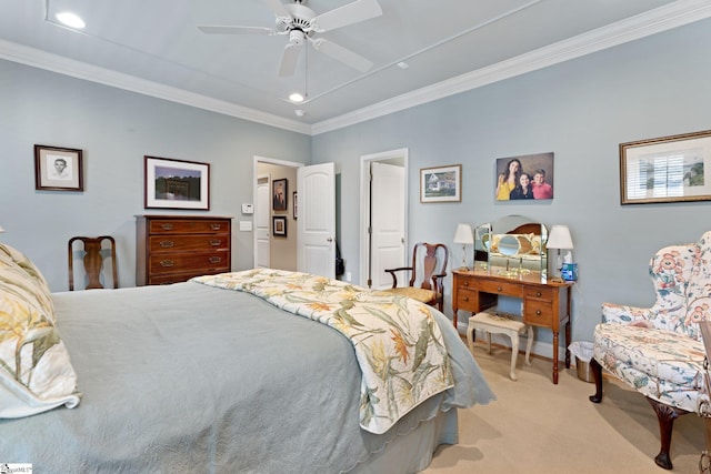 carpeted bedroom featuring ceiling fan and crown molding